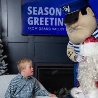 Boy looks at with Santa and Louie